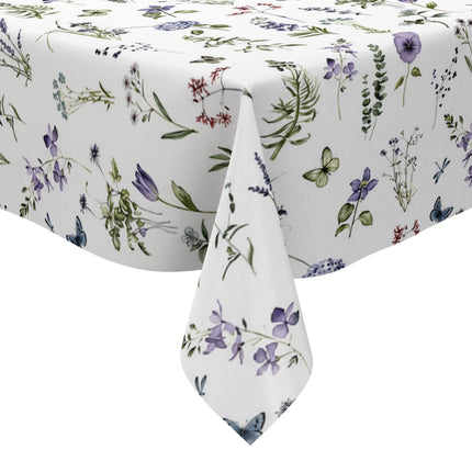 Weiße Wachstuch-Tischdecke mit zartem Wiesenblumen-Muster aus Wildblumen, Gräsern, Schmetterlingen und Libellen in sanften Violett-, Blau- und Grüntönen.