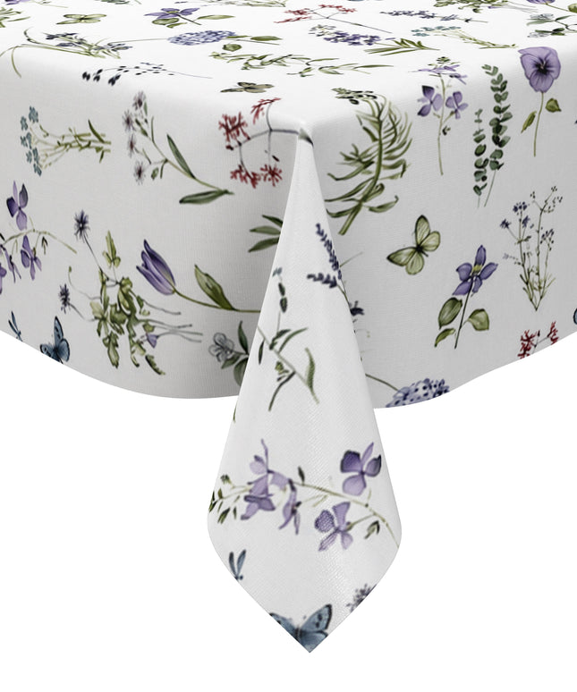 Weiße Wachstuch-Tischdecke mit zartem Wiesenblumen-Muster aus Wildblumen, Gräsern, Schmetterlingen und Libellen in sanften Violett-, Blau- und Grüntönen.