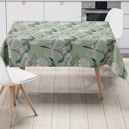 Wachstuch-Tischdecke mit tropischem Blättermuster auf mintgrünem Hintergrund. Weiße, graue und grüne Blätter mit feinen schwarzen Konturen sind gleichmäßig verteilt und erzeugen ein modernes, frisches Naturdesign.