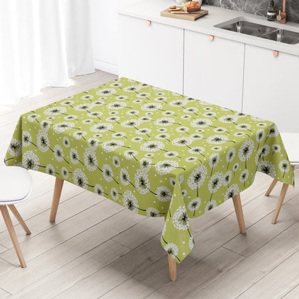 Wachstuch-Tischdecke mit weißen Pusteblumen in verschiedenen Größen auf hellgrünem Hintergrund. Schwarze Stiele und kleine weiße Punkte ergänzen das verspielte, natürliche Design mit leichter, frischer Ausstrahlung.