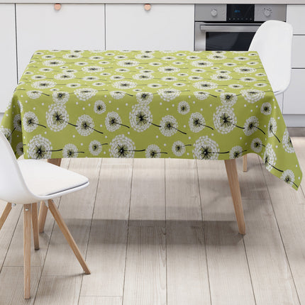 Wachstuch-Tischdecke mit weißen Pusteblumen in verschiedenen Größen auf hellgrünem Hintergrund. Schwarze Stiele und kleine weiße Punkte ergänzen das verspielte, natürliche Design mit leichter, frischer Ausstrahlung.
