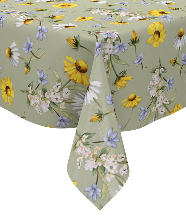 Wachstuch-Tischdecke mit Wiesenblumenmuster auf salbeigrünem Hintergrund. Gelbe Blüten, weiße Margeriten, kleine blaue Blumen und zarte weiße Blütenzweige sind gleichmäßig verteilt und sorgen für eine frische, natürliche Ausstrahlung.